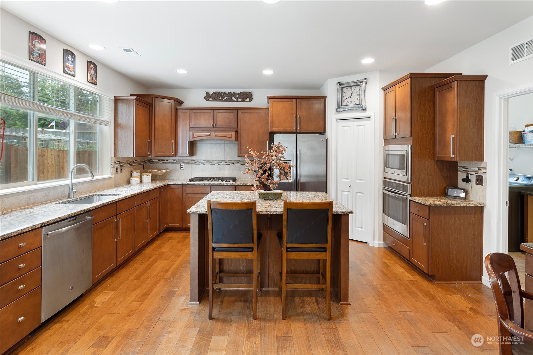 16224 Southeast 138th Place Renton, WA 98059 - Photo 15 of 40 a large kitchen with a table and chairs in it