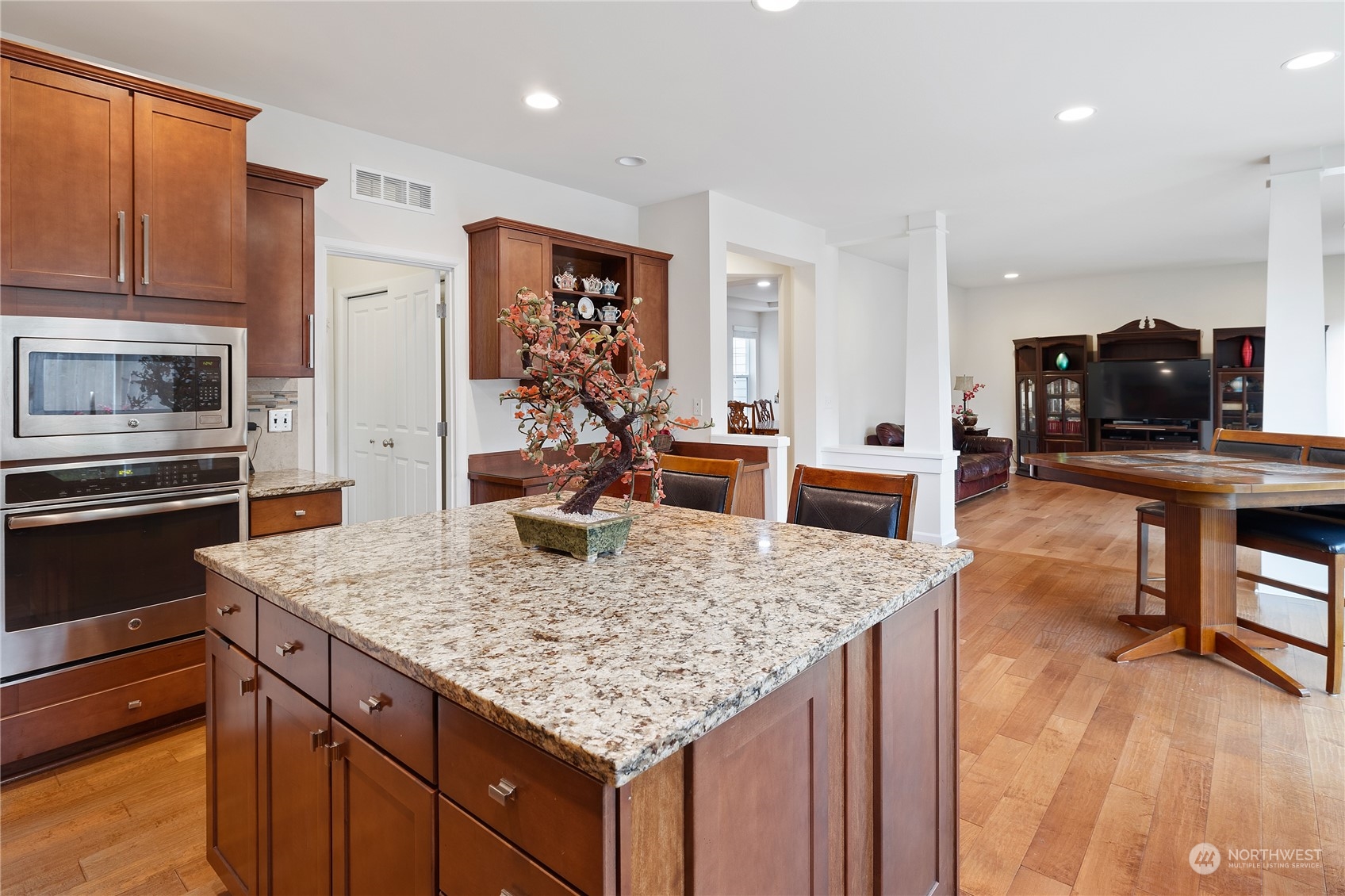 16224 Southeast 138th Place Renton, WA 98059 - Photo 16 of 40 a kitchen with stainless steel appliances granite countertop a kitchen island a stove and a sink