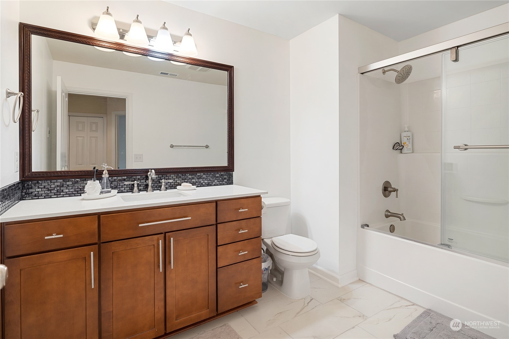 16224 Southeast 138th Place Renton, WA 98059 - Photo 22 of 40 a bathroom with a sink a toilet and shower