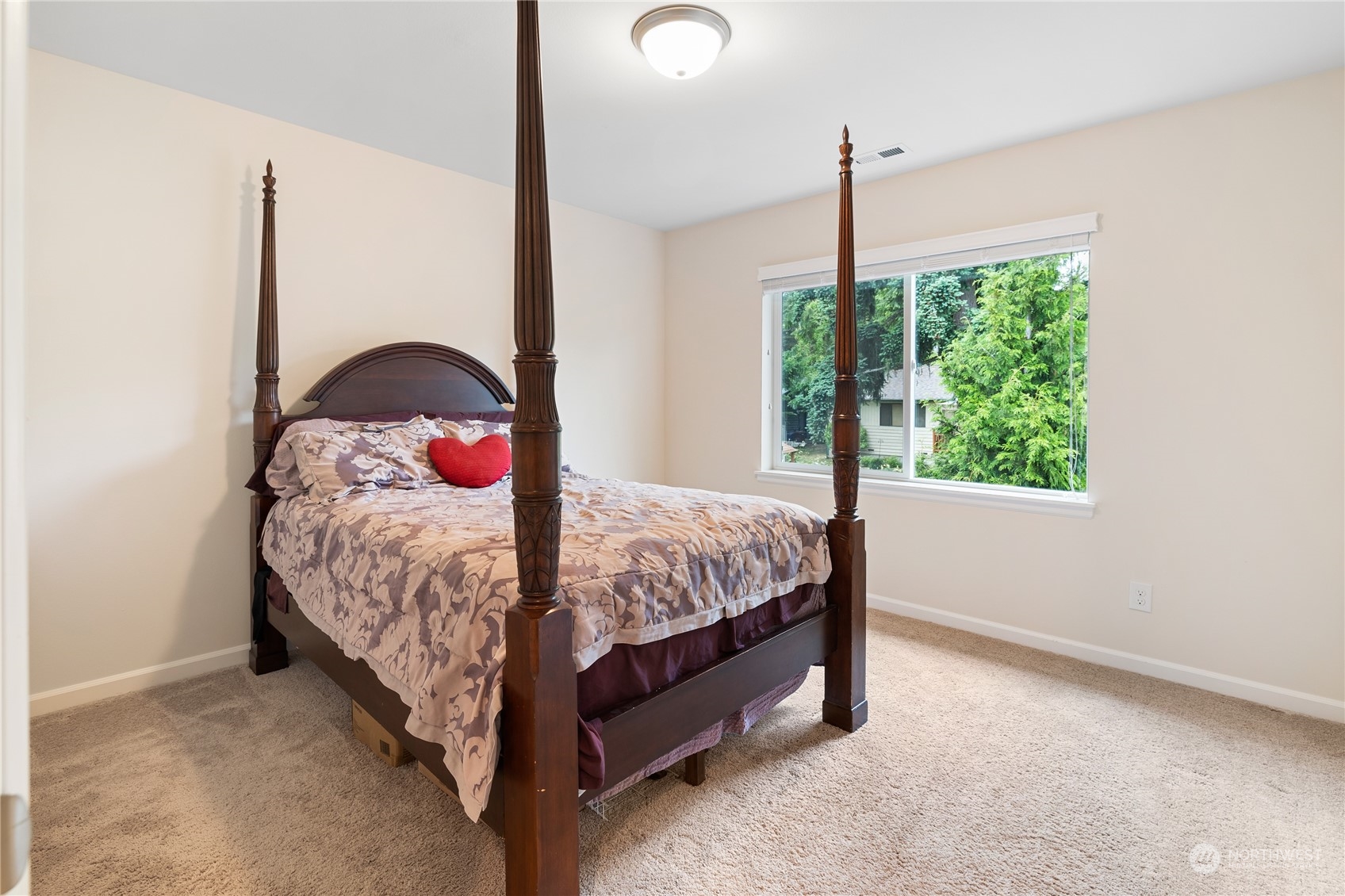 16224 Southeast 138th Place Renton, WA 98059 - Photo 24 of 40 a bed sitting in a bedroom next to a window