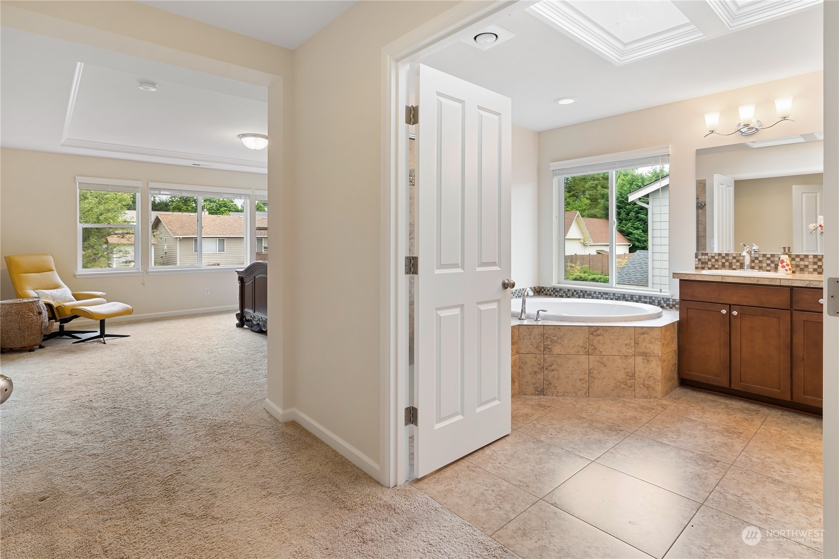 16224 Southeast 138th Place Renton, WA 98059 - Photo 27 of 40 a view of a kitchen with kitchen island and windows in it