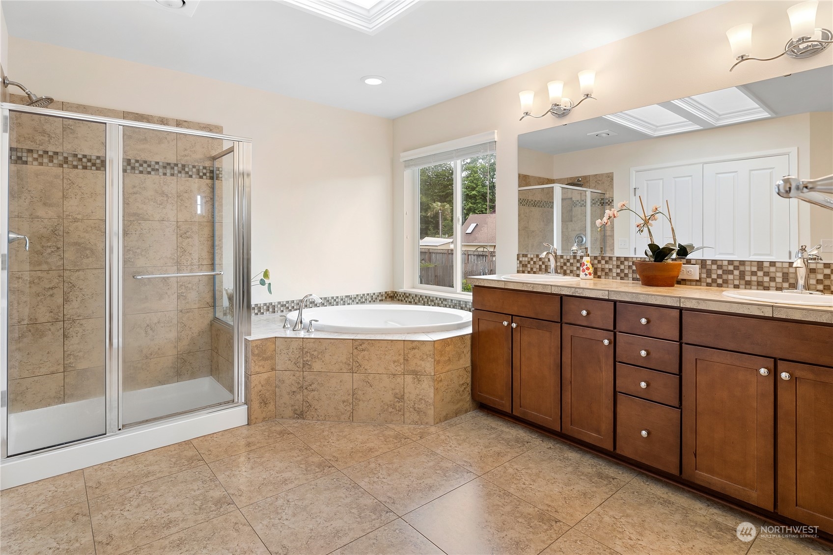 16224 Southeast 138th Place Renton, WA 98059 - Photo 28 of 40 a bathroom with a sink double vanity and a shower