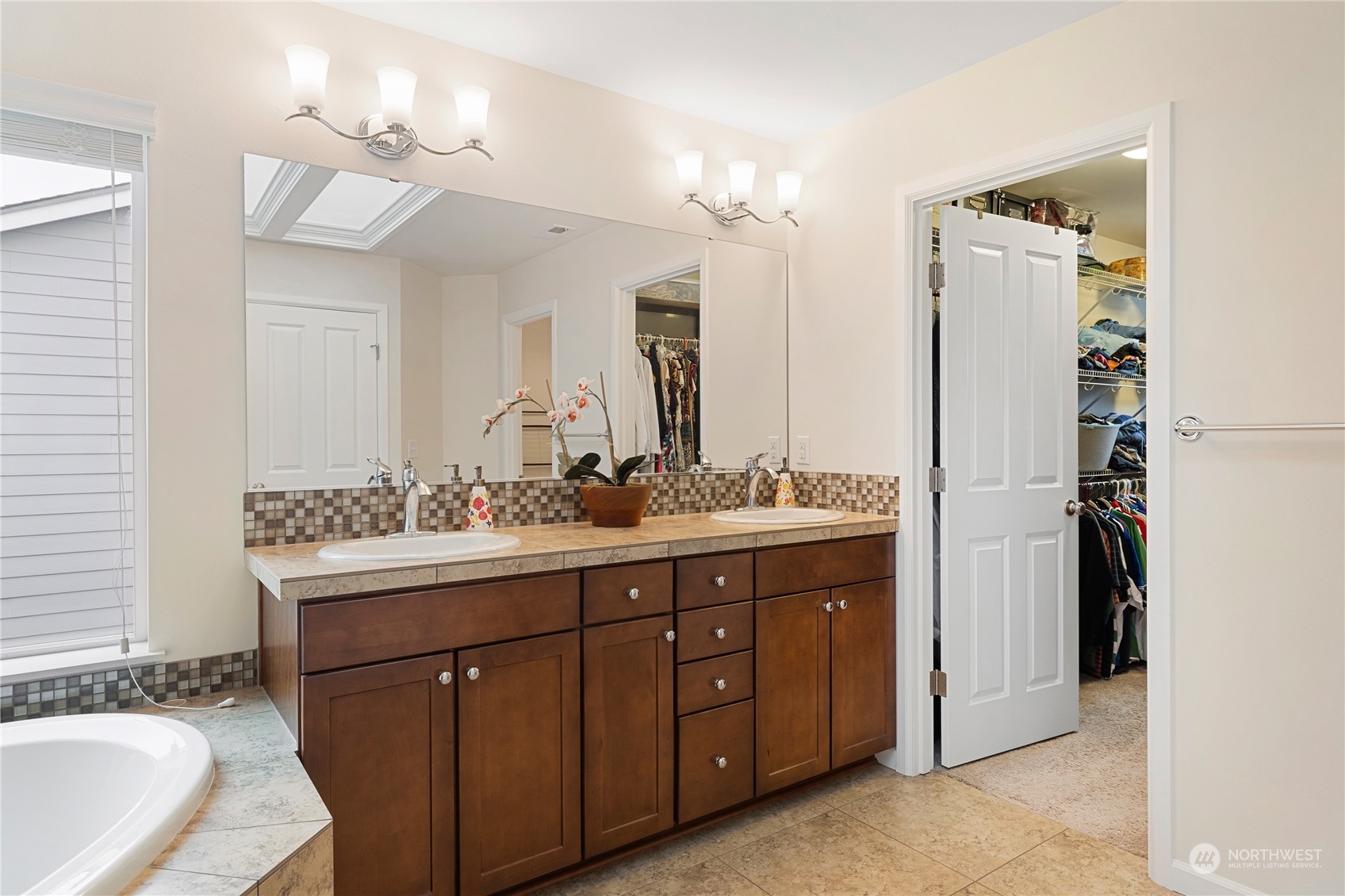 16224 Southeast 138th Place Renton, WA 98059 - Photo 29 of 40 a spacious bathroom with a granite countertop sink mirror and double