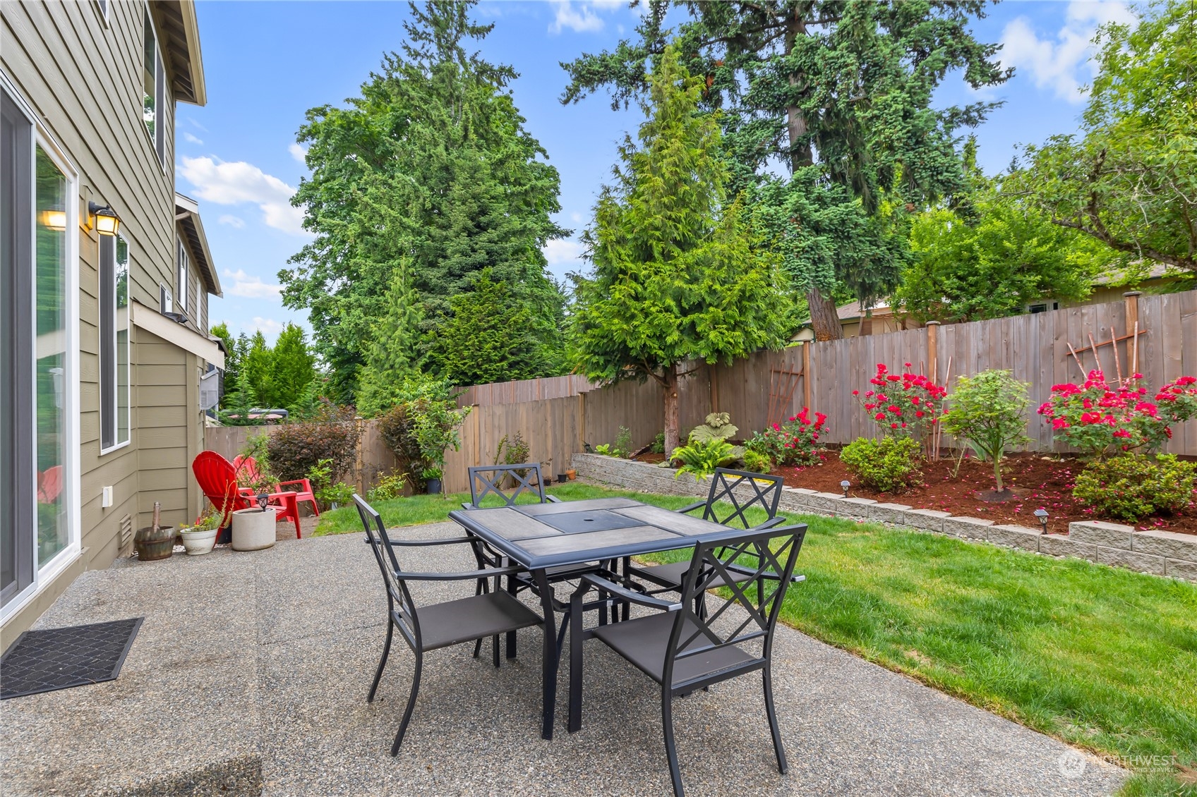 16224 Southeast 138th Place Renton, WA 98059 - Photo 31 of 40 a view of chair and table in backyard of the house