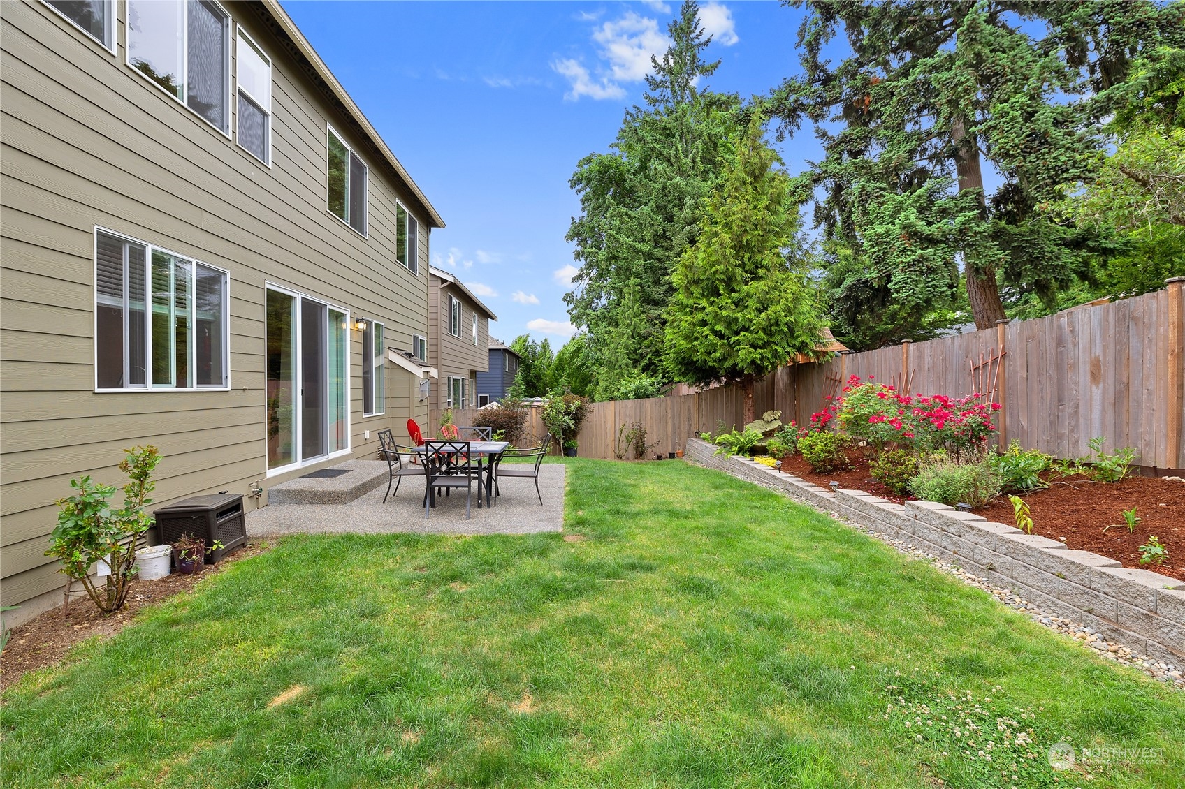 16224 Southeast 138th Place Renton, WA 98059 - Photo 32 of 40 a view of backyard with seating and green space