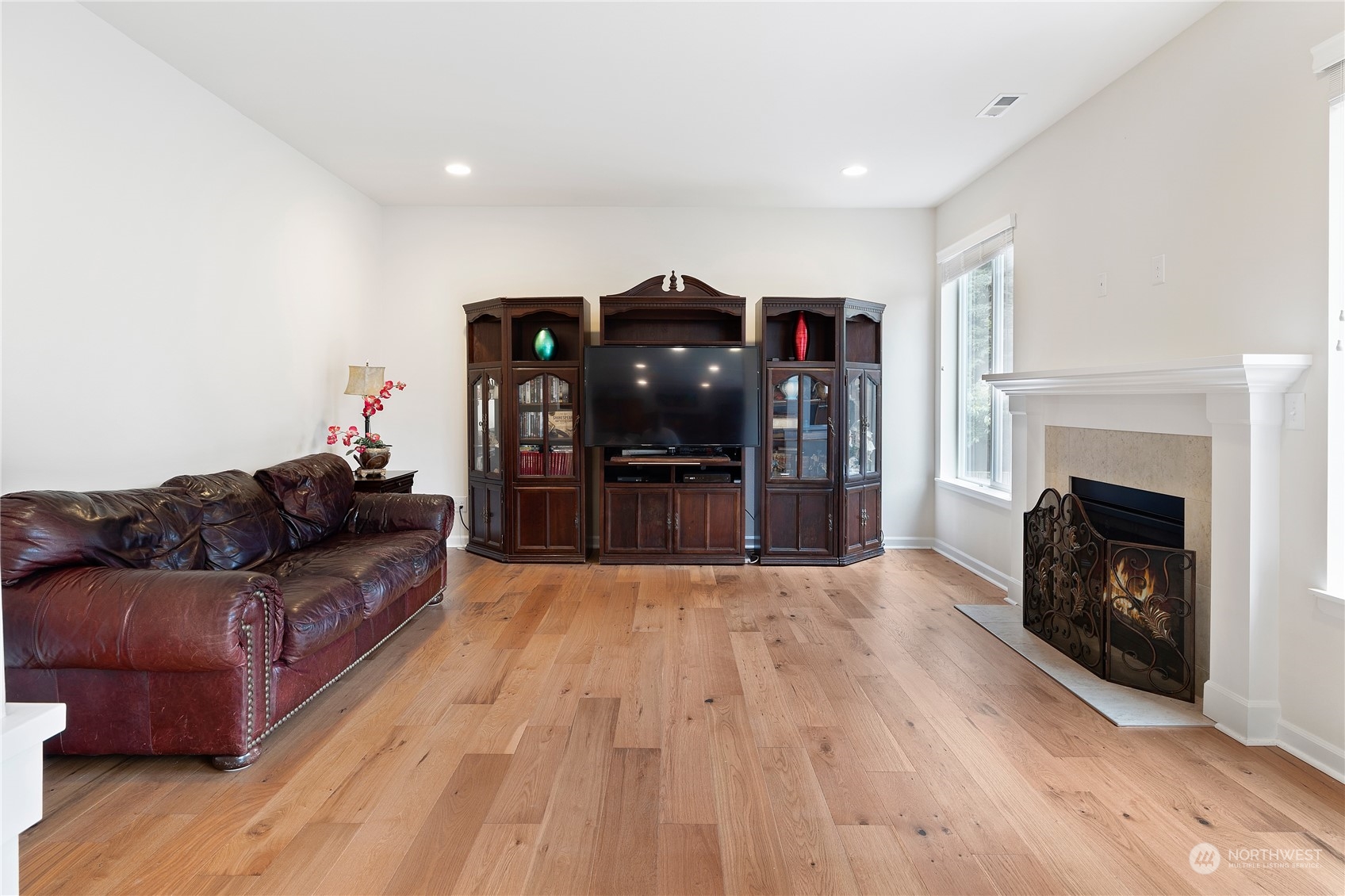 16224 Southeast 138th Place Renton, WA 98059 - Photo 10 of 40 a living room with furniture and a fireplace