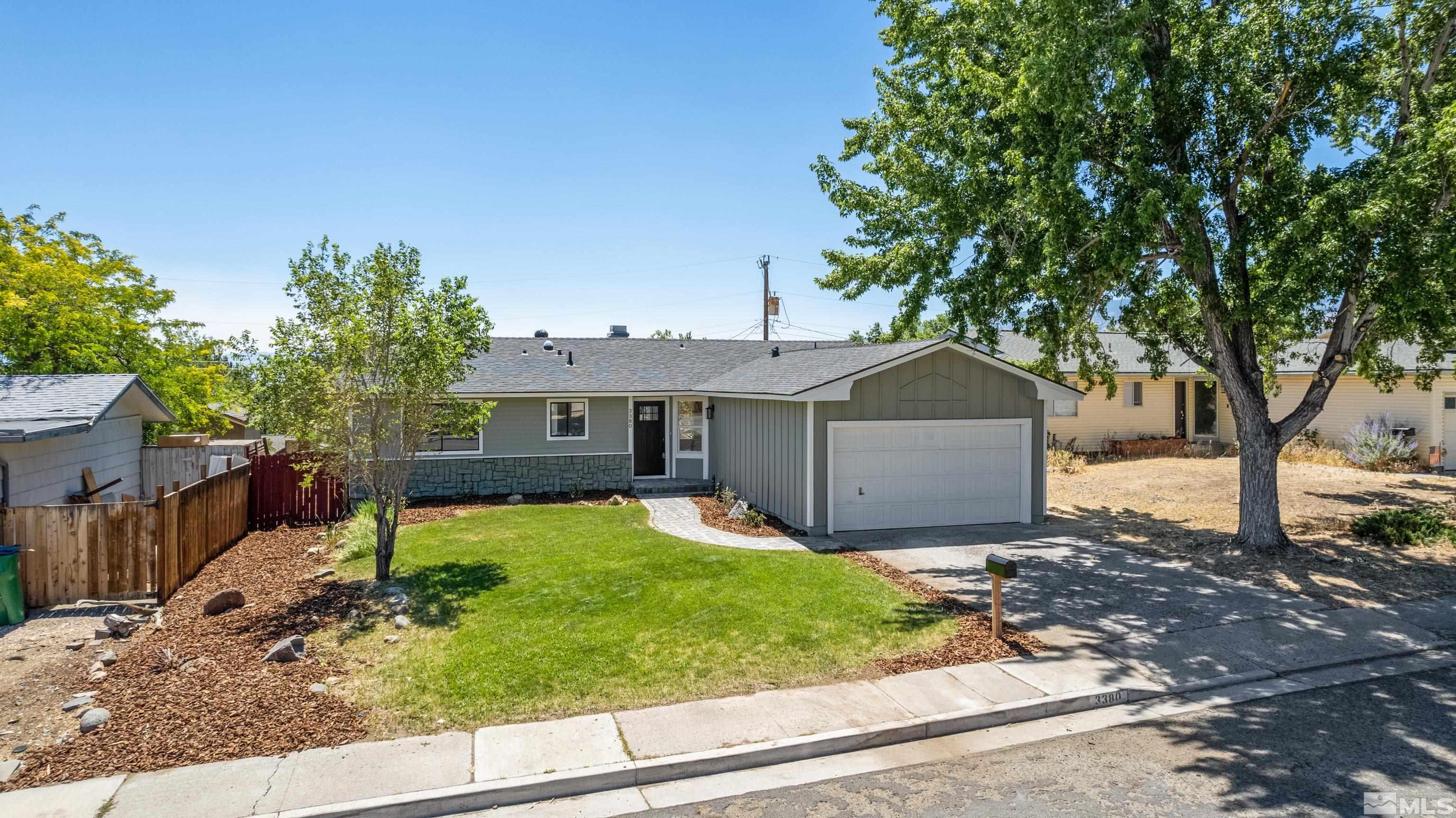 3380 Bryan Street Reno, NV 89503 - Photo 18 of 40 a front view of a house with garden