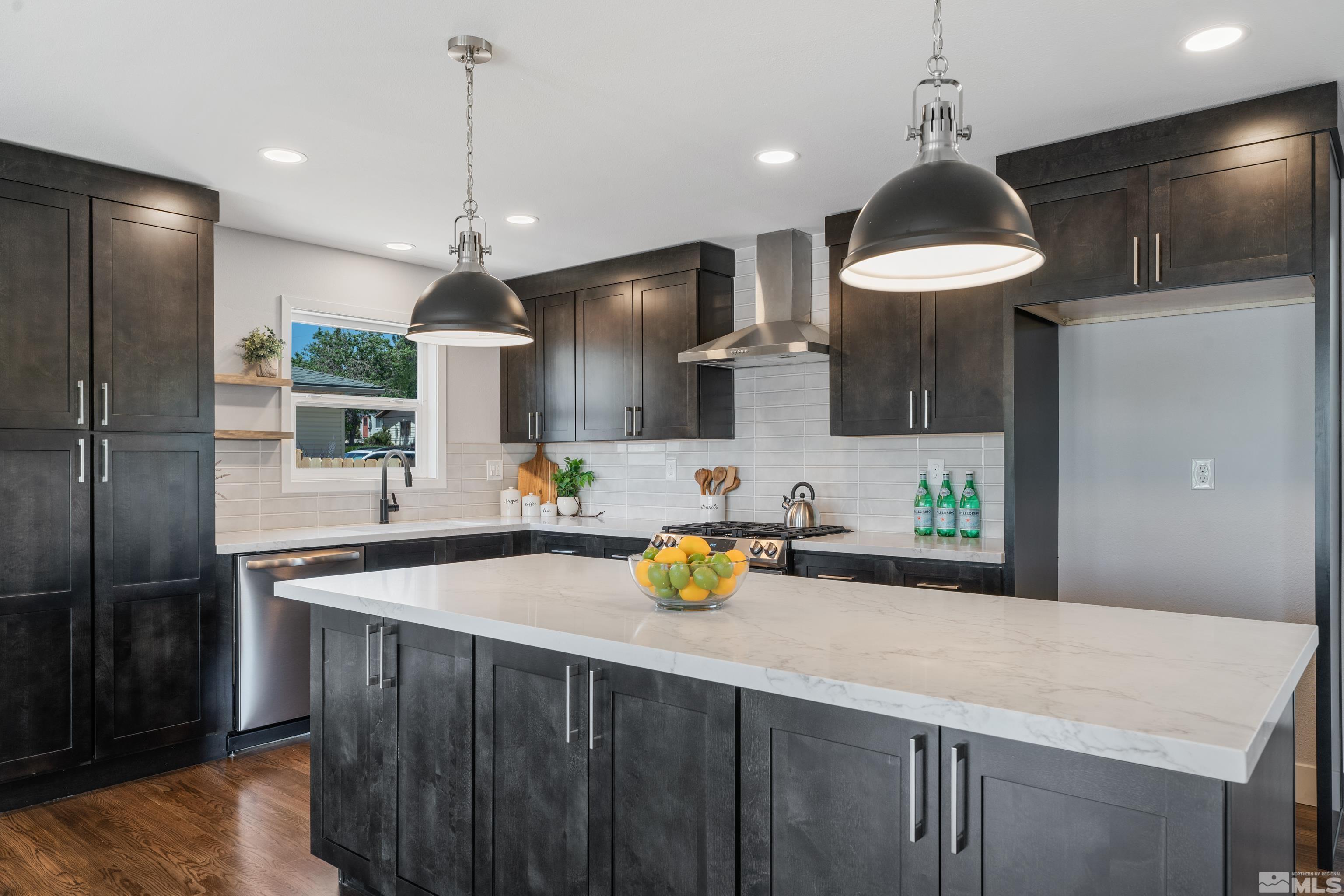 3380 Bryan Street Reno, NV 89503 - Photo 2 of 40 a kitchen with a sink a counter space appliances and cabinets