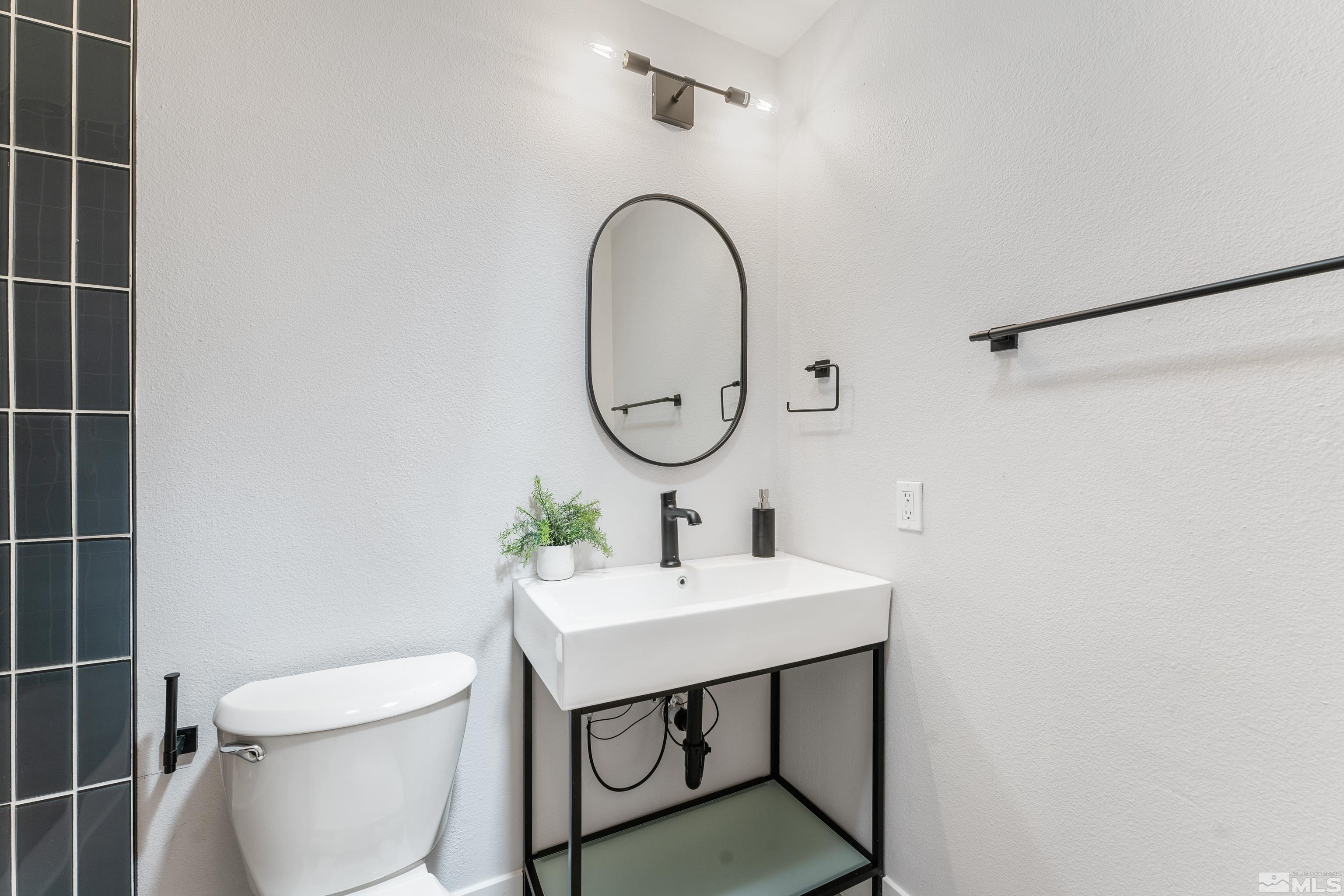 3380 Bryan Street Reno, NV 89503 - Photo 27 of 40 a bathroom with a sink toilet and a mirror