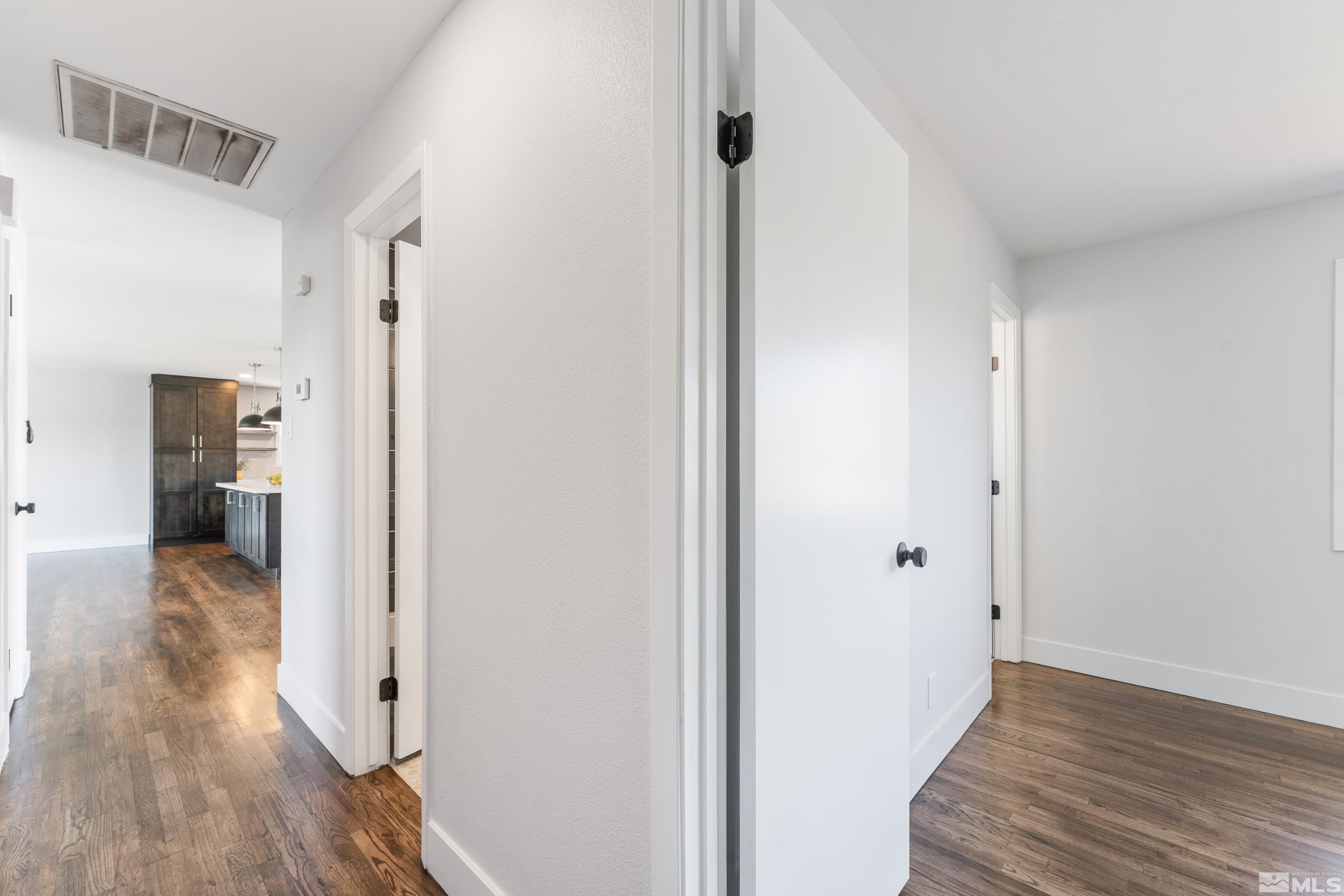 3380 Bryan Street Reno, NV 89503 - Photo 28 of 40 a view of a hallway with wooden floor