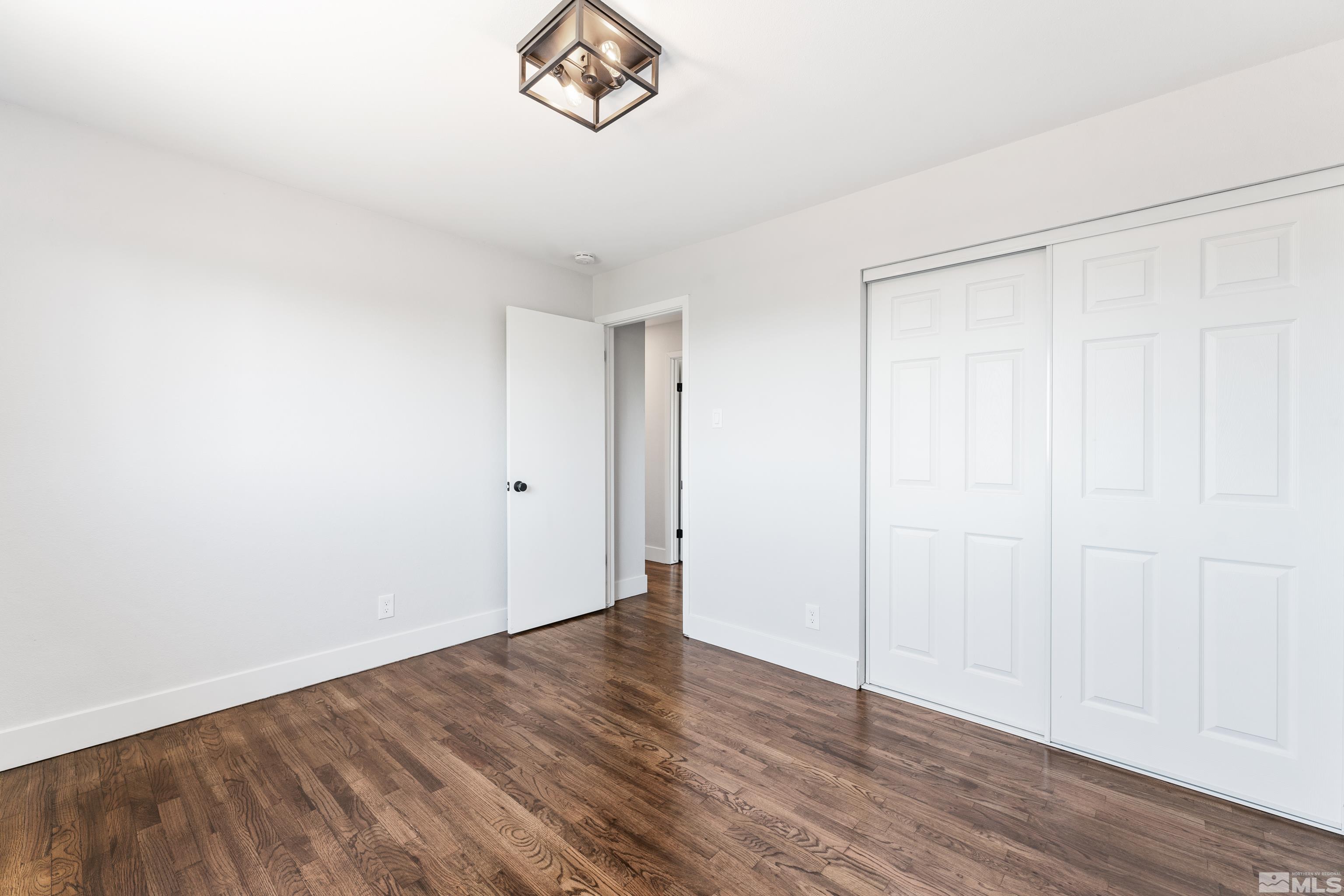 3380 Bryan Street Reno, NV 89503 - Photo 29 of 40 a view of an empty room with wooden floor