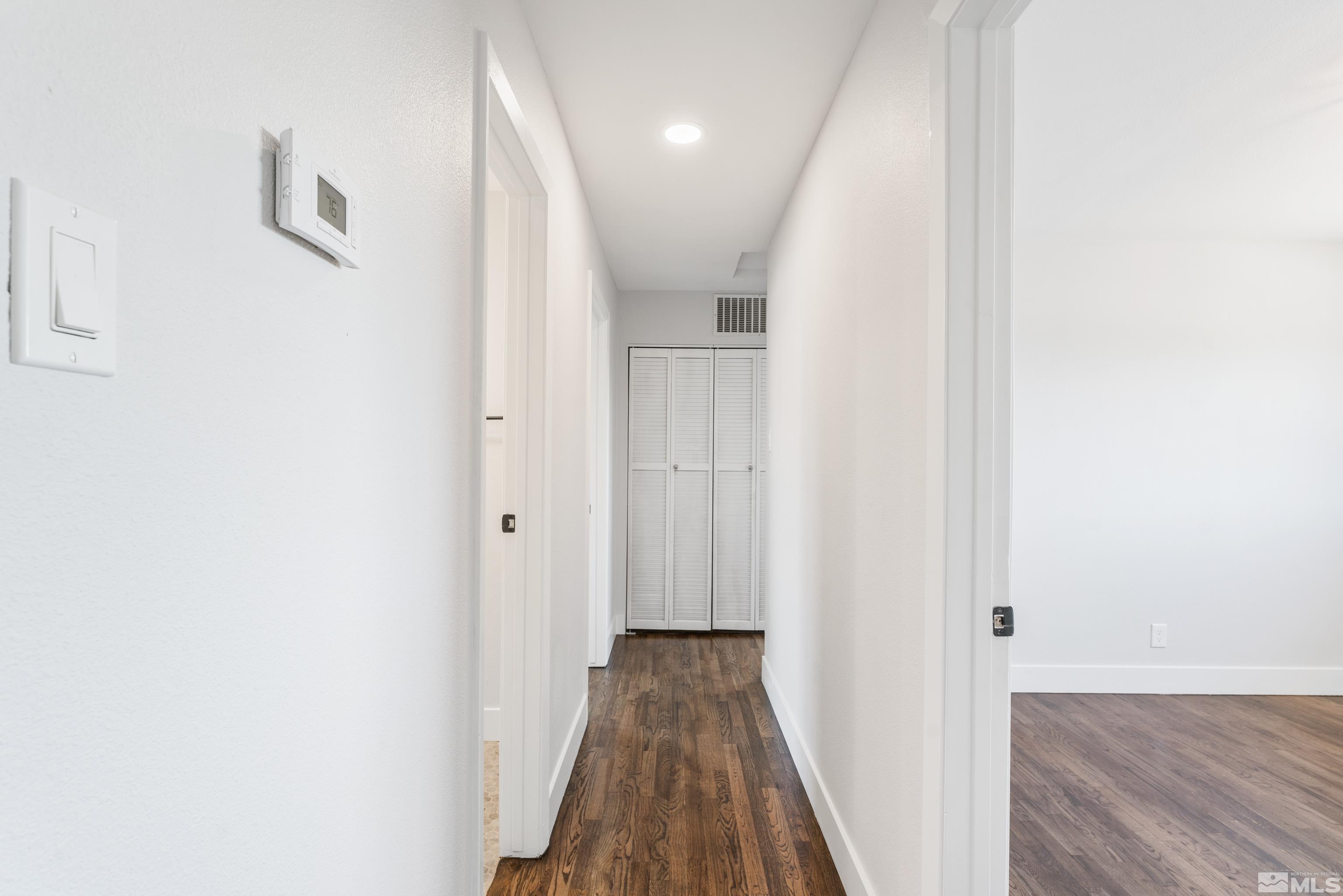3380 Bryan Street Reno, NV 89503 - Photo 34 of 40 a view of a hallway with wooden floor