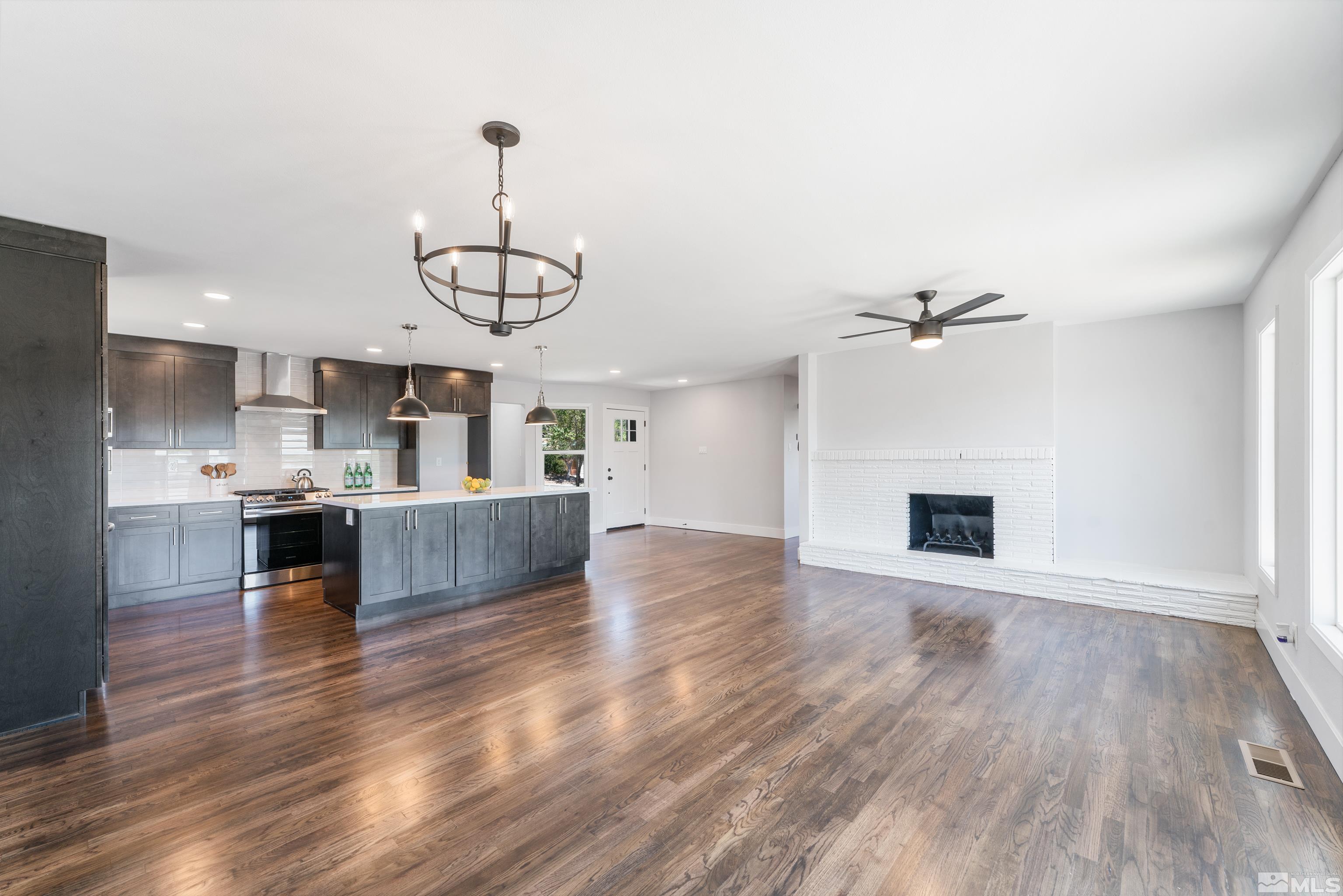 3380 Bryan Street Reno, NV 89503 - Photo 8 of 40 a view of kitchen with sink microwave refrigerator and stove