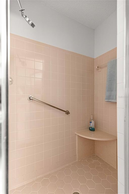 8962 Southwest 97th Street, Unit D Ocala, FL 34481 - Photo 27 of 56 a bathroom with a shower