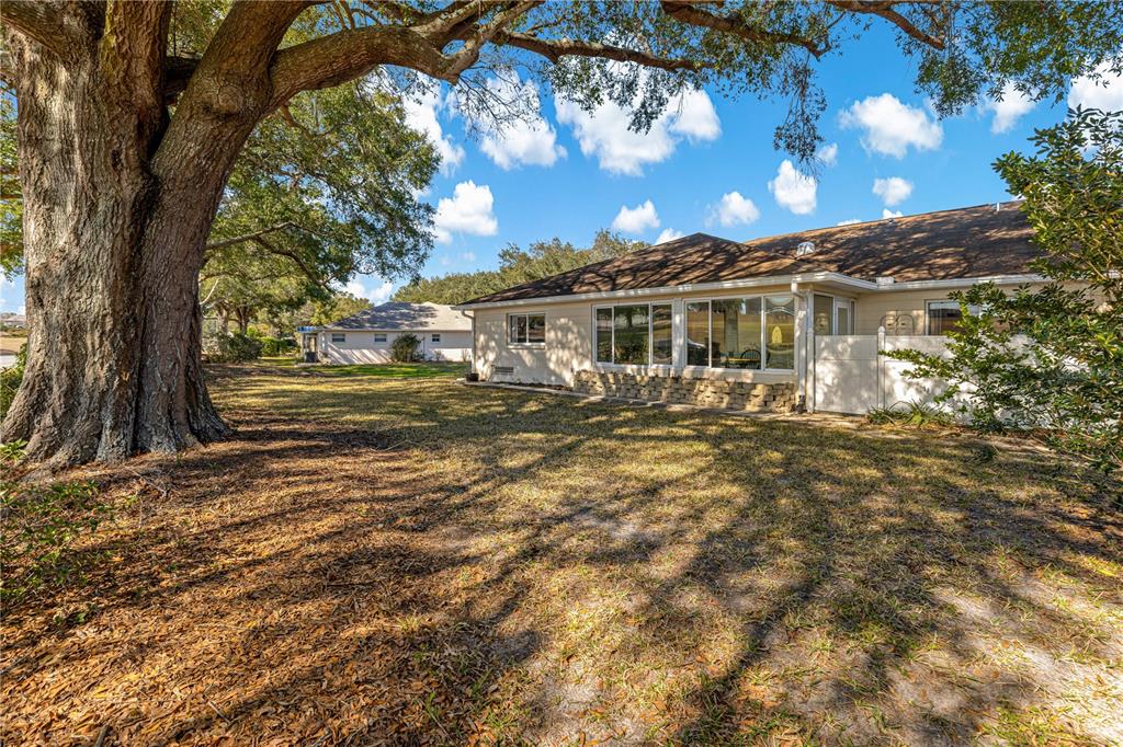 8962 Southwest 97th Street, Unit D Ocala, FL 34481 - Photo 45 of 56 a view of a house with a yard