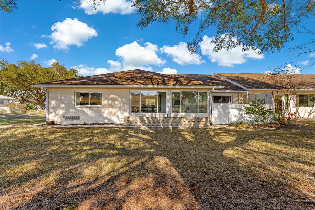 8962 Southwest 97th Street, Unit D Ocala, FL 34481 - Photo 46 of 56 a view of a house with a swimming pool