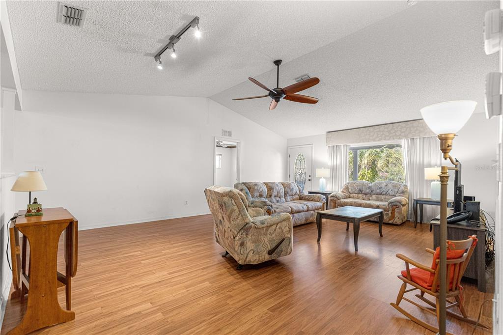 8962 Southwest 97th Street, Unit D Ocala, FL 34481 - Photo 8 of 56 a living room with furniture and a large window