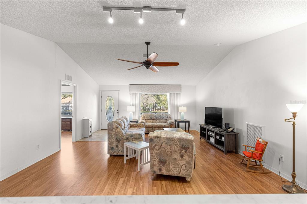 8962 Southwest 97th Street, Unit D Ocala, FL 34481 - Photo 9 of 56 a living room with furniture fireplace and a window