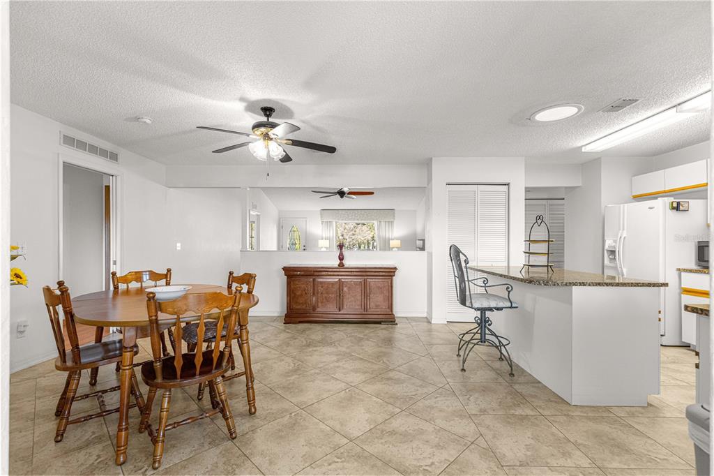 8962 Southwest 97th Street, Unit D Ocala, FL 34481 - Photo 10 of 56 a view of a dining room with furniture and a chandelier
