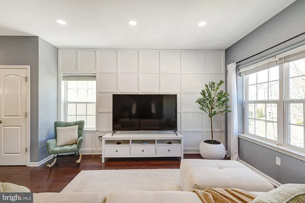 a kitchen with stainless steel appliances granite countertop a sink a stove and refrigerator