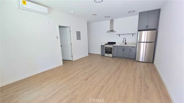 a kitchen with stainless steel appliances a refrigerator and a sink