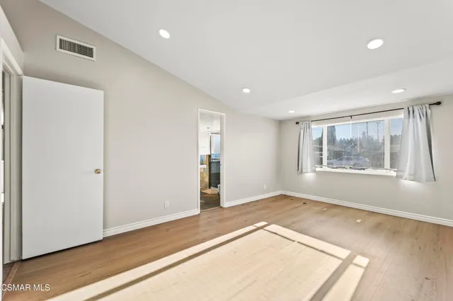 a bed room with a bed and a couch