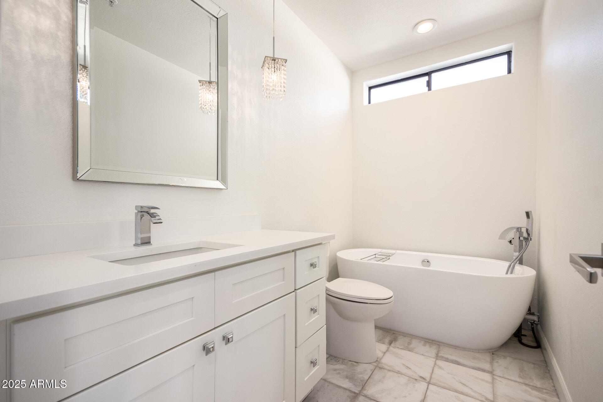 7222 East Gainey Ranch Road, Unit 241 Scottsdale, AZ 85258 - Photo 13 of 74 a bathroom with a granite countertop sink a toilet and a mirror