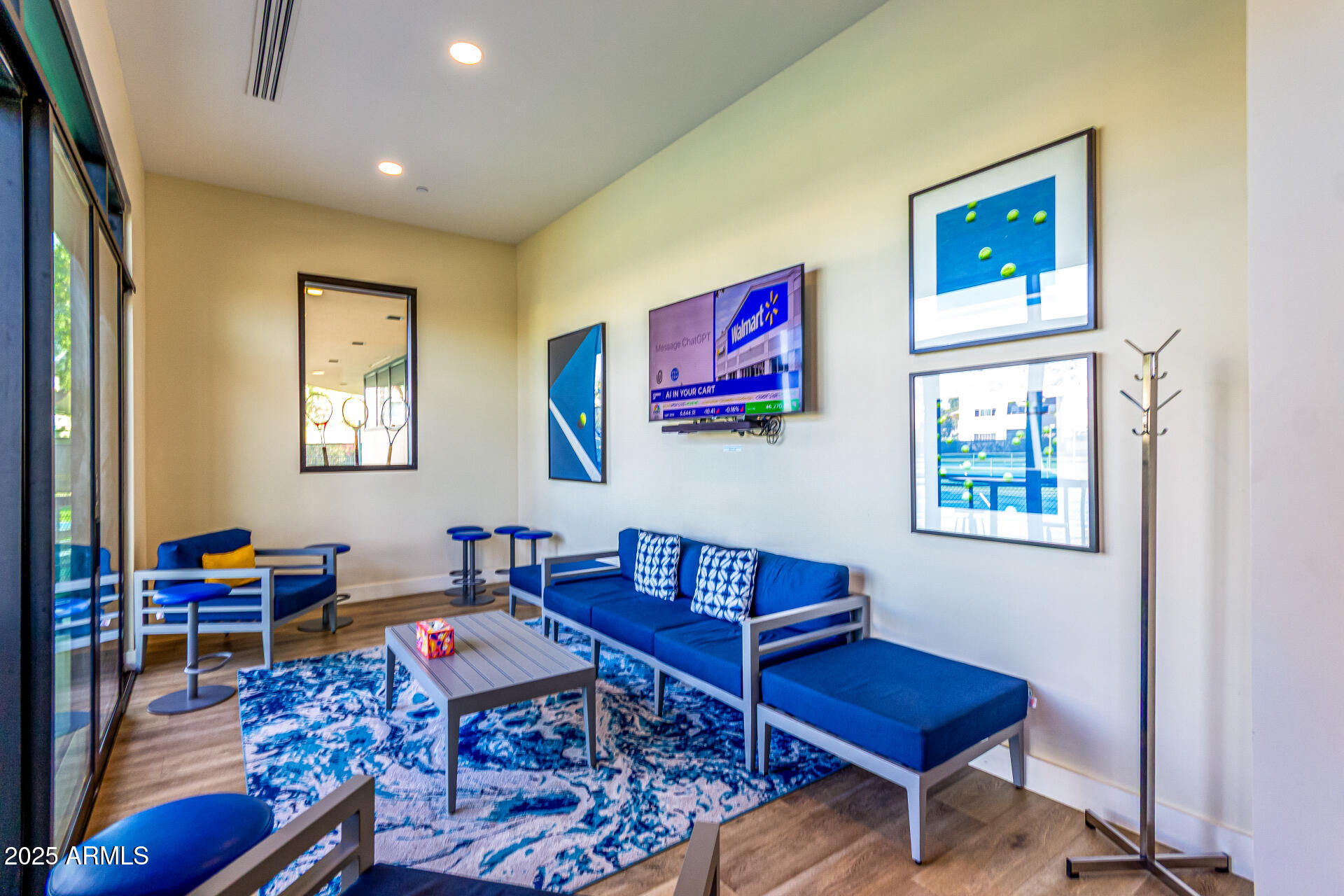 7222 East Gainey Ranch Road, Unit 241 Scottsdale, AZ 85258 - Photo 20 of 74 a living room with furniture a rug and a window