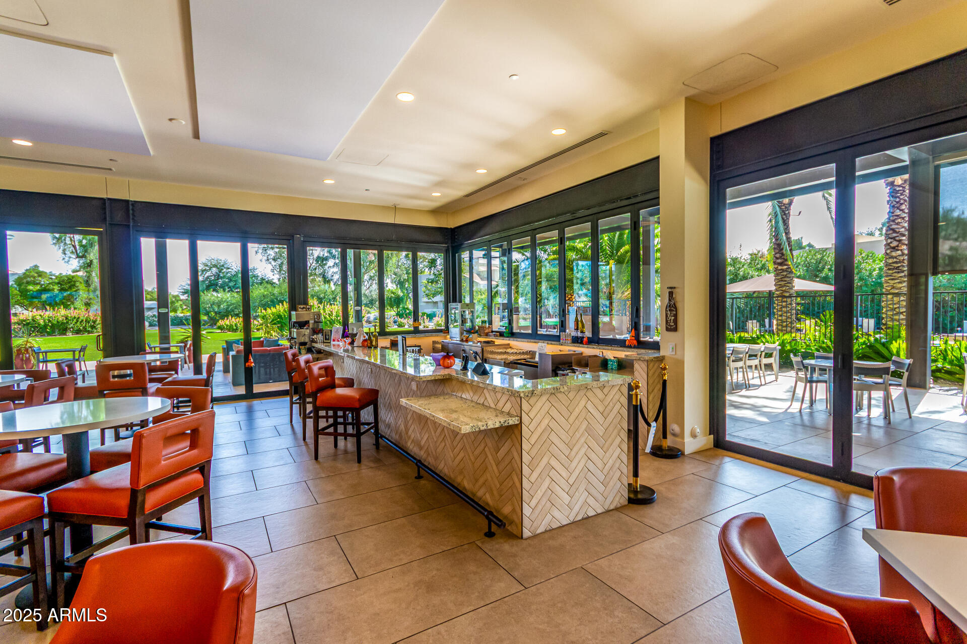 7222 East Gainey Ranch Road, Unit 241 Scottsdale, AZ 85258 - Photo 24 of 74 a living room with furniture and a large window