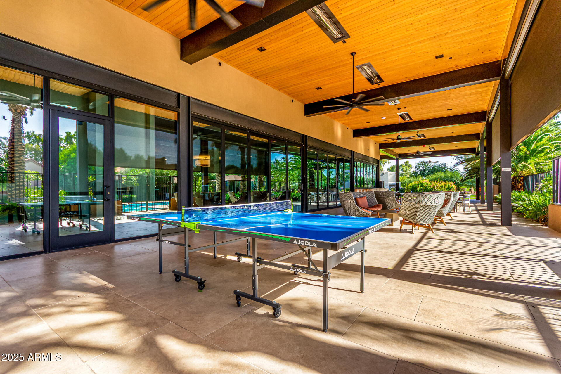 7222 East Gainey Ranch Road, Unit 241 Scottsdale, AZ 85258 - Photo 25 of 74 a view of a patio with a table chairs and a patio