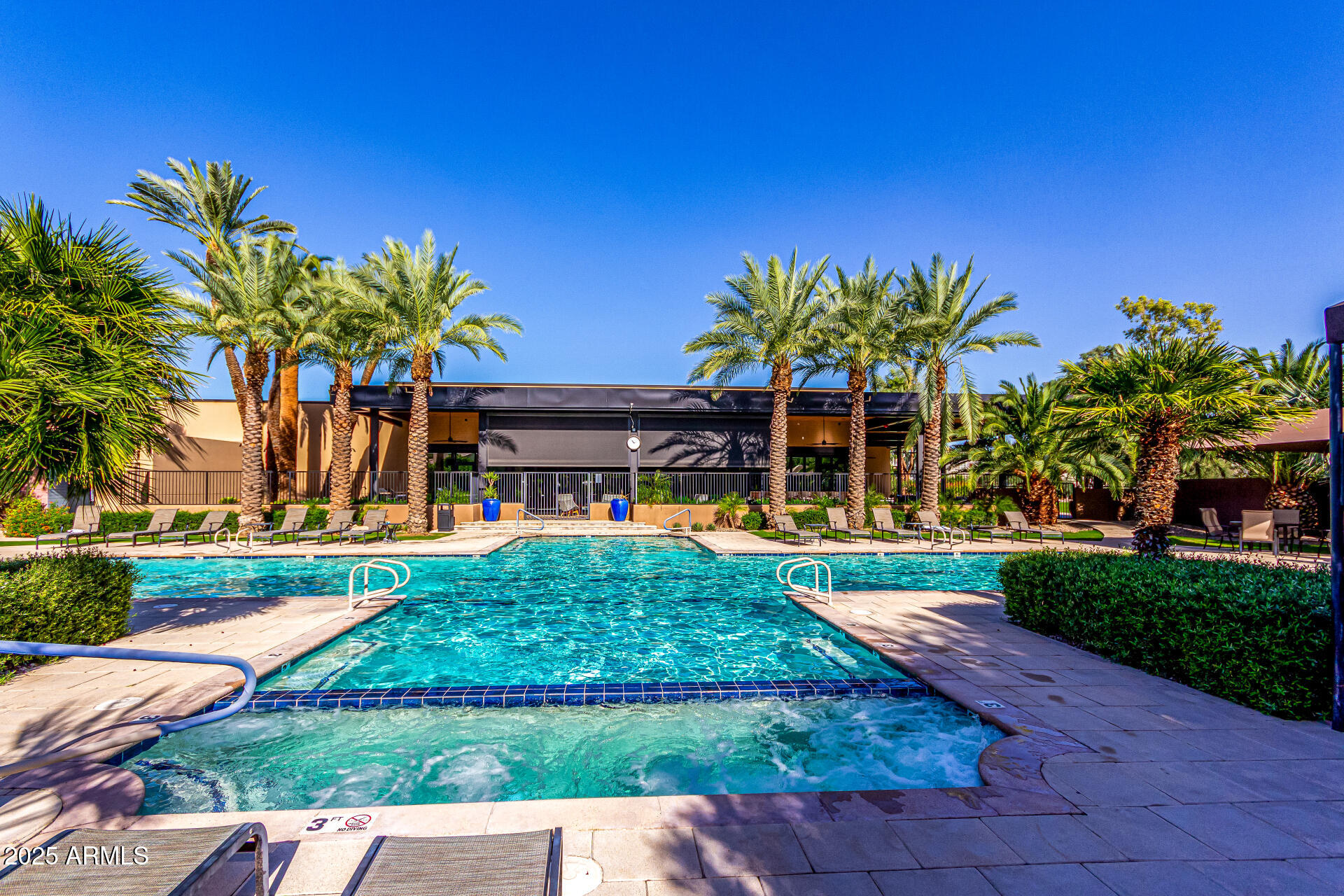 7222 East Gainey Ranch Road, Unit 241 Scottsdale, AZ 85258 - Photo 27 of 74 a front view of a house with garden