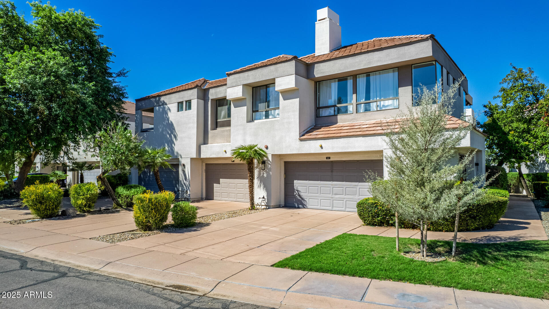 7222 East Gainey Ranch Road, Unit 241 Scottsdale, AZ 85258 - Photo 45 of 74 a front view of a house with a yard