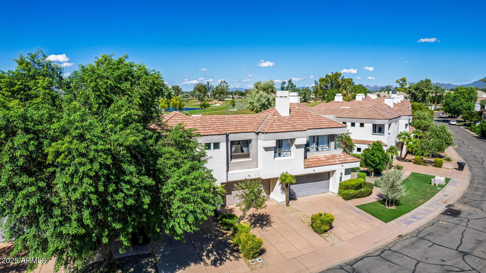 7222 East Gainey Ranch Road, Unit 241 Scottsdale, AZ 85258 - Photo 47 of 74 front view of a house with a yard