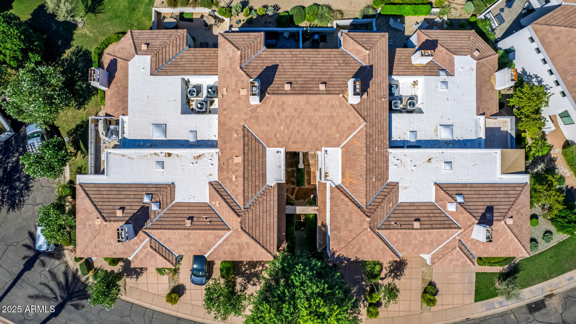 7222 East Gainey Ranch Road, Unit 241 Scottsdale, AZ 85258 - Photo 58 of 74 an aerial view of residential houses with outdoor space