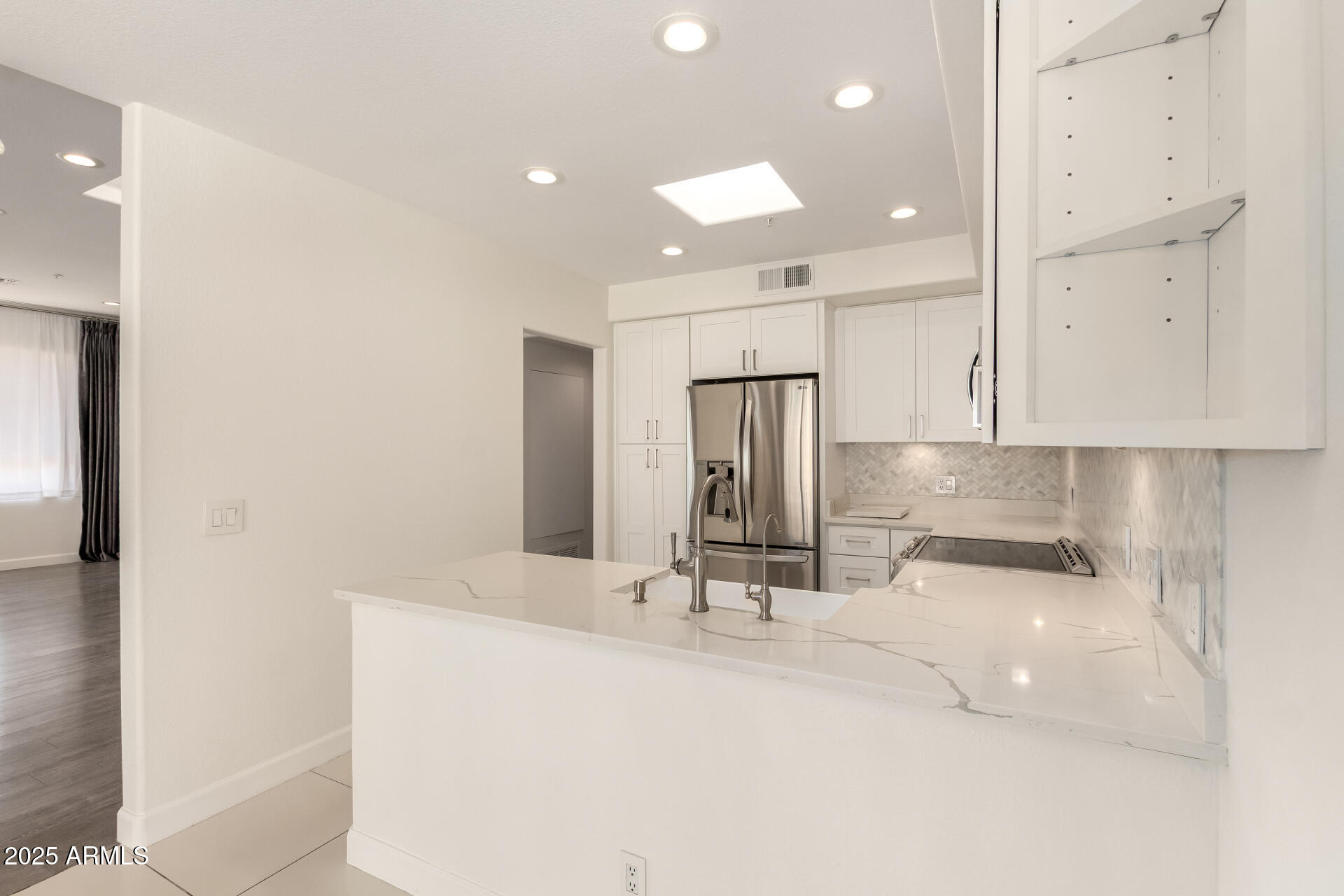 7222 East Gainey Ranch Road, Unit 241 Scottsdale, AZ 85258 - Photo 64 of 74 a bathroom with a sink and a mirror