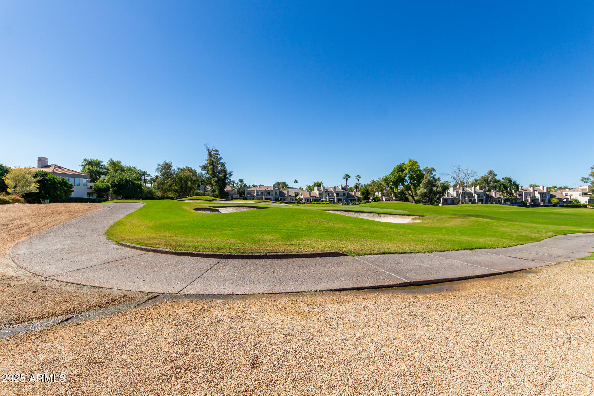 7222 East Gainey Ranch Road, Unit 241 Scottsdale, AZ 85258 - Photo 73 of 74 a view of a golf course with a big yard
