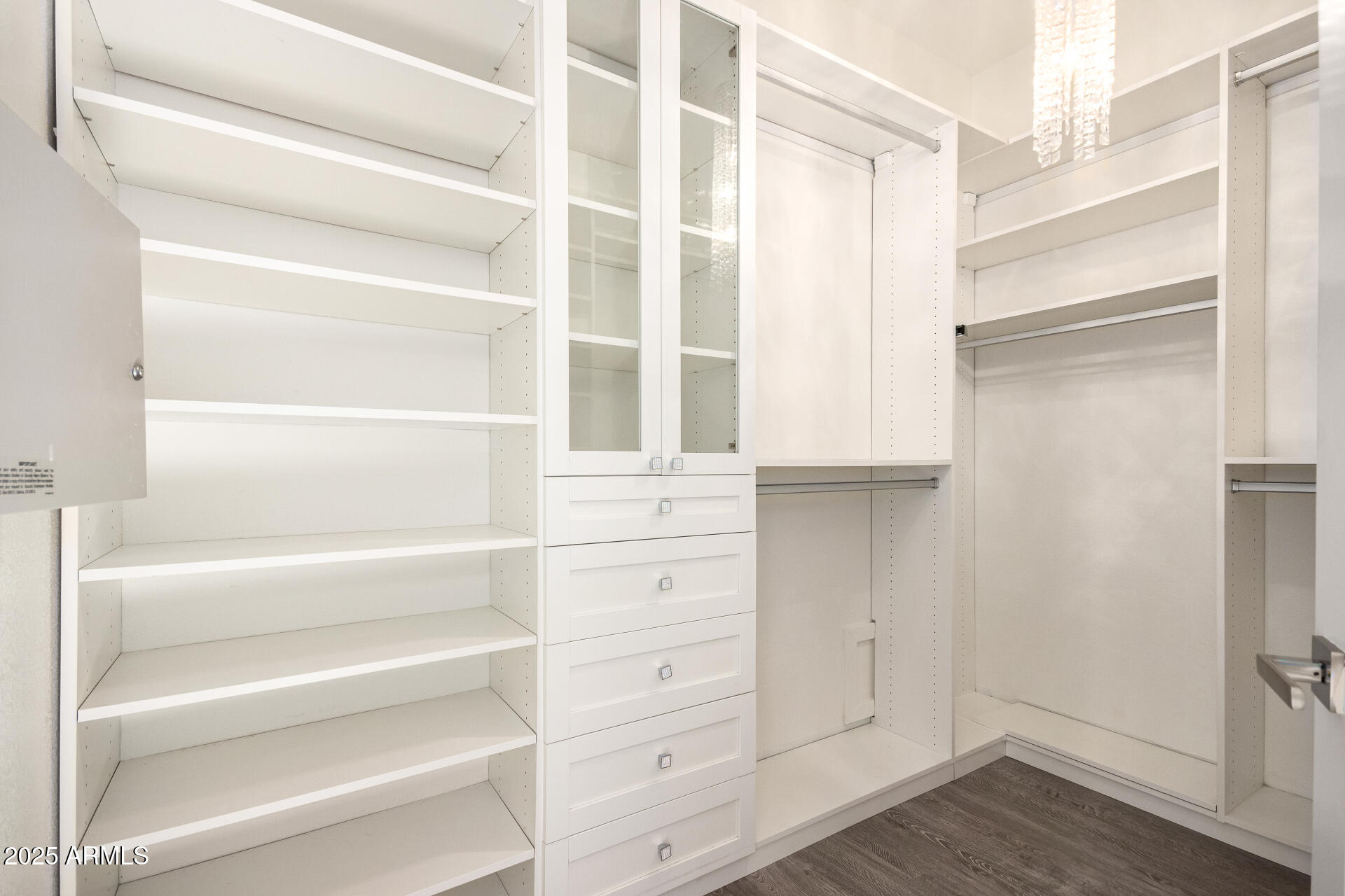 7222 East Gainey Ranch Road, Unit 241 Scottsdale, AZ 85258 - Photo 9 of 74 a view of walk in closet with empty racks
