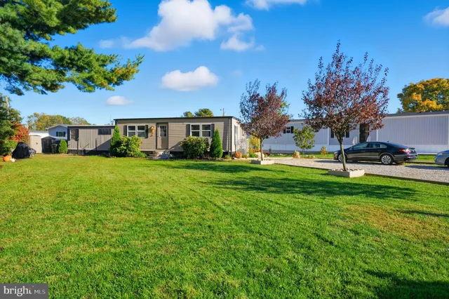 a view of a house with a big yard