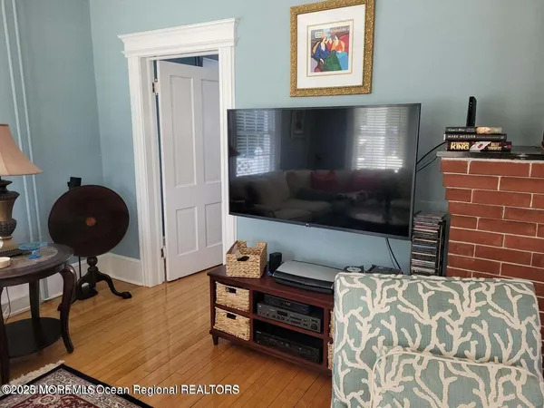 a bedroom with furniture and a lamp