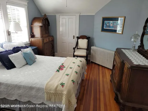 a bedroom with double bed and a window