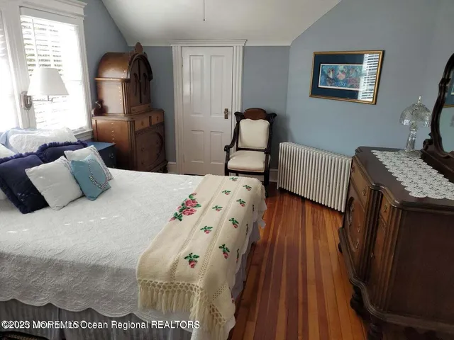 a bedroom with double bed and a window