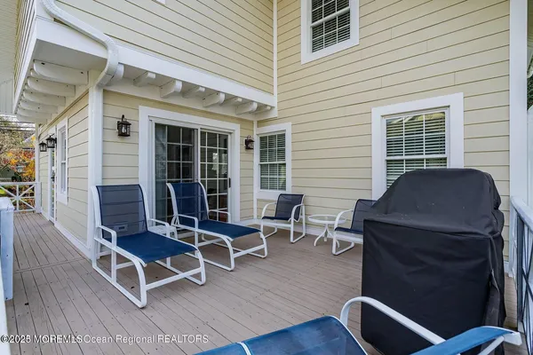 a view of a deck with table and chairs