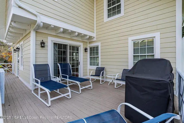 a view of a deck with table and chairs