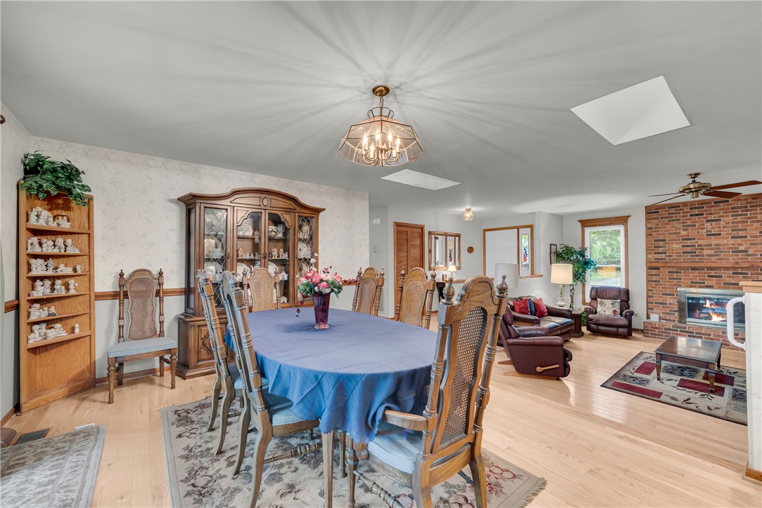 103 Colleton Court Clemson, SC 29631 - Photo 6 of 49 Gleaming hardwood floors and a classic brick fireplace anchor this bright open living area.