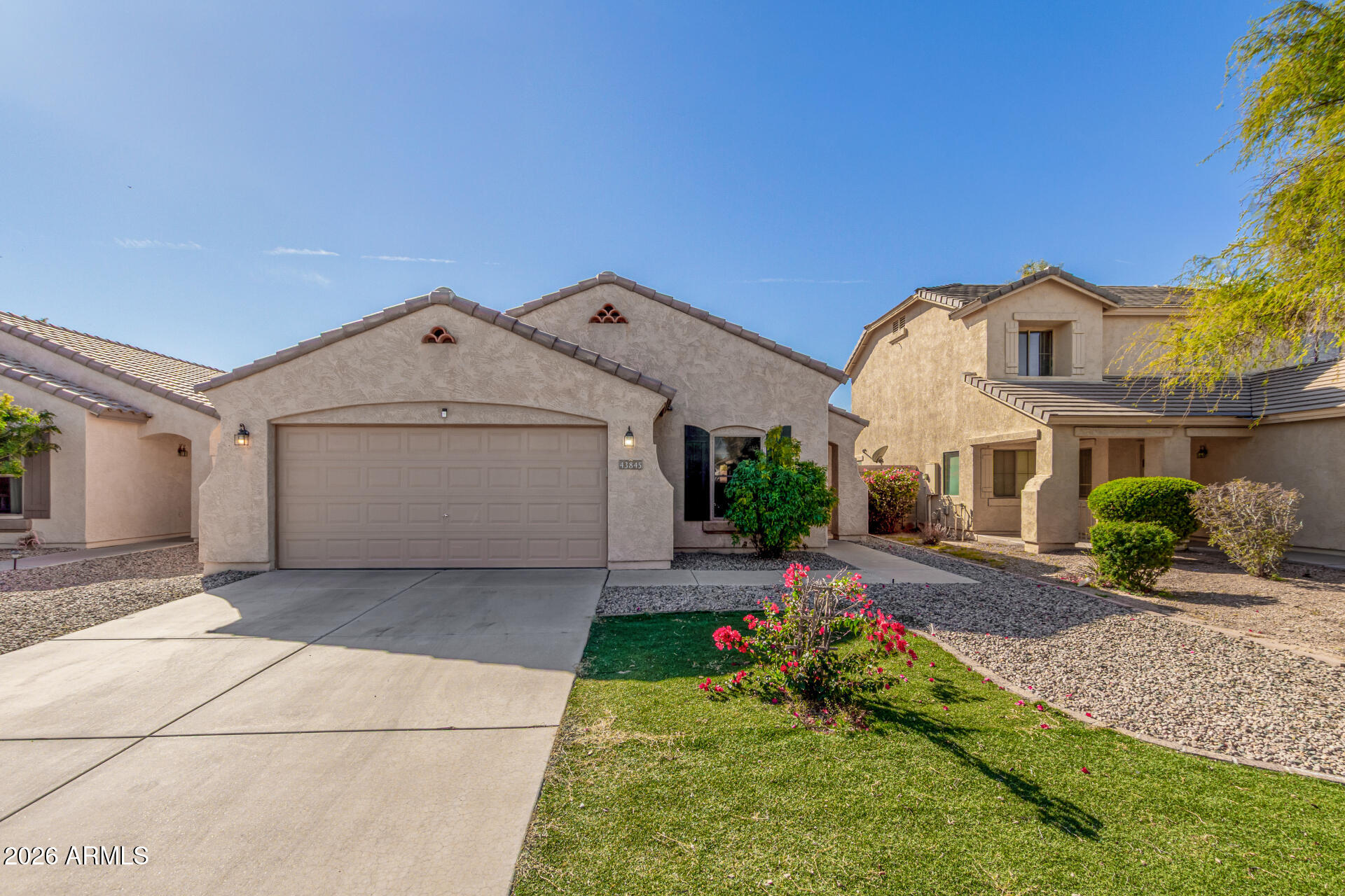 43845 West Elizabeth Avenue Maricopa, AZ 85138 - Photo 1 of 30 a view of a house with a yard