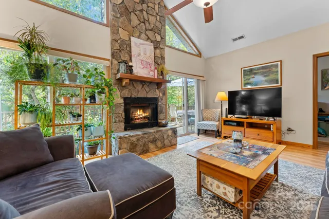 a large kitchen with stainless steel appliances granite countertop a large stove a sink dishwasher and a microwave oven with cabinets