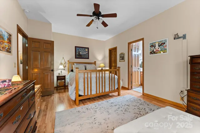 a bedroom with a large bed and a large window