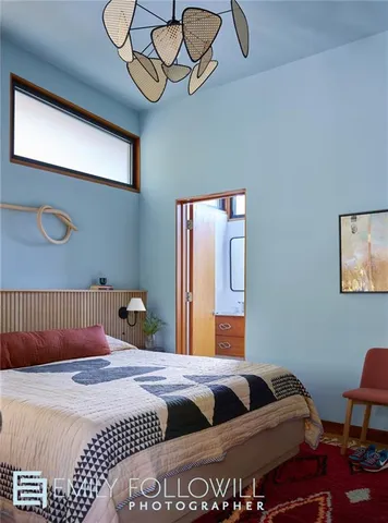 a bedroom with a bed and dresser