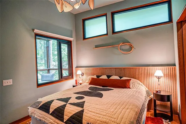 a bedroom with a bed and window