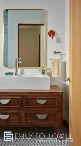 a bathroom with a sink and a mirror